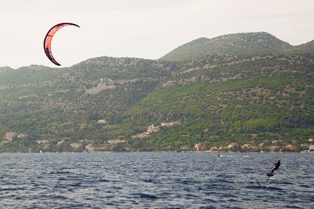 People surf with kite most popular way of extreme water sport this daysの写真素材