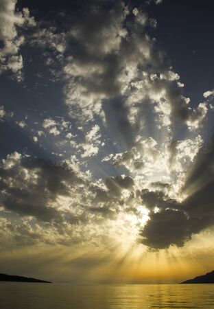 Beautiful sunset over Adriatic sea with wondarful clouds play in Croatiaの写真素材