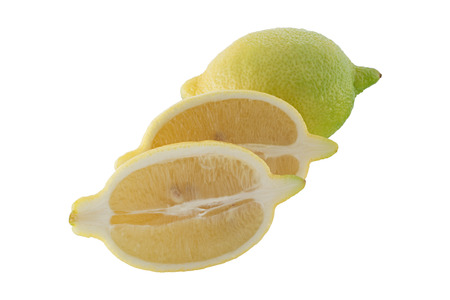 Sliced lemon and green lemon isolated on white backgroundの写真素材