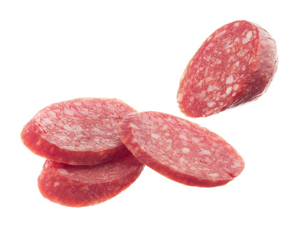 Smoked sausage by slices isolated on white backgroundの写真素材