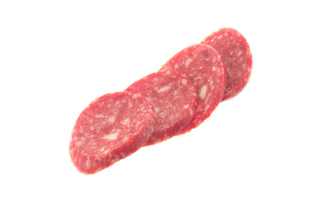 Smoked sausage by slices isolated on white backgroundの写真素材