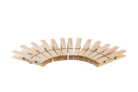 Wooden clothespins in semicircle isolated on white backgroundの写真素材