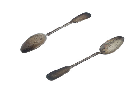 Unpeeled vintage silver spoons isolated on white backgroundの写真素材