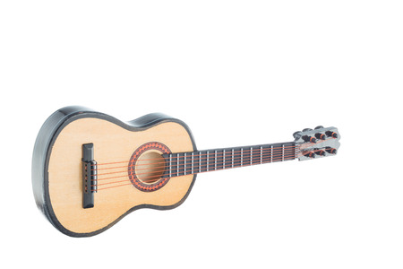 Little wooden guitar souvenir isolated on white backgroundの写真素材