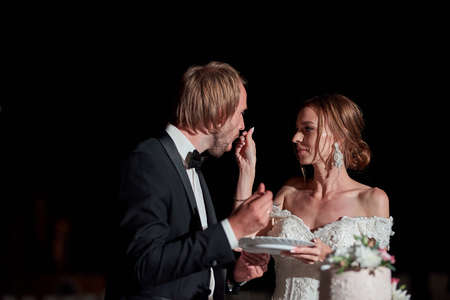 bride and groom cut the cakeの写真素材