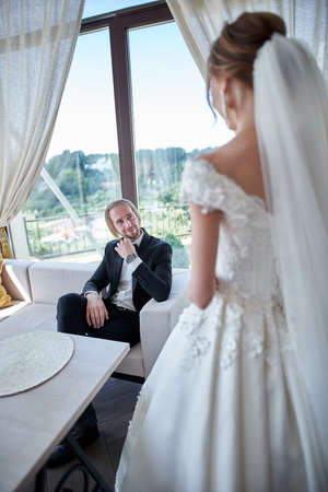 Wedding couple, groom and bride, together in a restaurant on wedding dayの写真素材