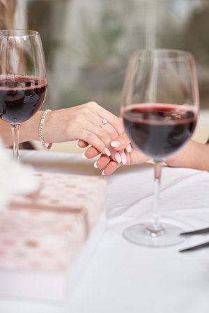 young bride shows a wedding ring to her friendsの写真素材