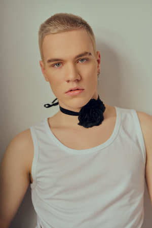 Handsome young man posing in studio. Men's beauty, fashion.