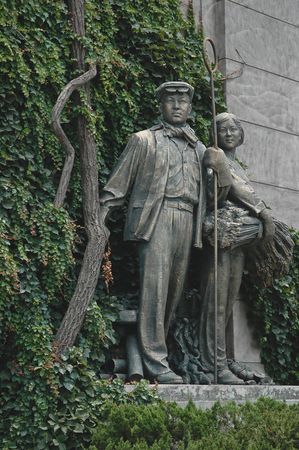 A couple of chinese communist propaganda statues - a worker and a peasant girl.の写真素材