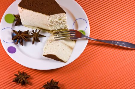 Tasty and colorful cheesecake with white coffee decoration on the top. の写真素材