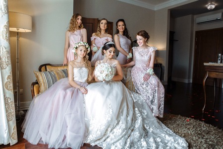 bridesmaids laugh with happiness at the weddingの写真素材