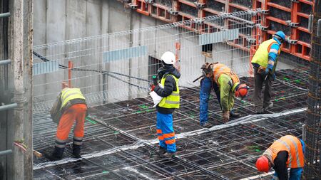 ukranian builders working on the construction site in polandの写真素材