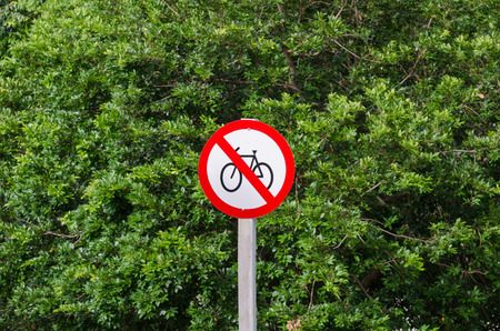 Warning plate forbidden to ride a bicycle in this areaの写真素材