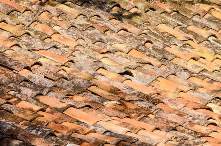 Old and moldy roof texture, poorly arranged and some broken tiles.の写真素材