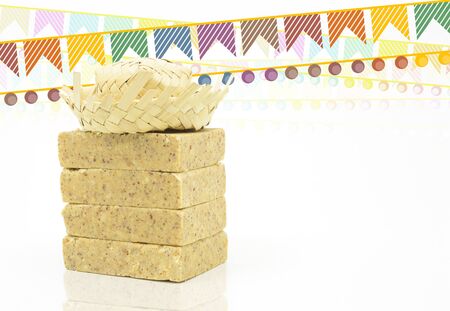Pacoca, brazilian peanut candy. Typical peanut candy from Festa Junina party. Festa Junina flags and...