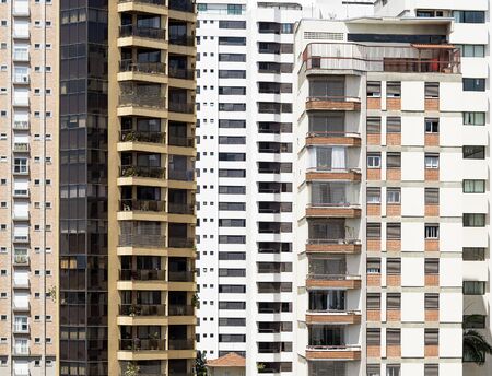 Close up on high density tall buildings of an urban area during the day. Residential buildings.