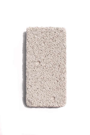 Pumice stone isolated on white background. Volcanic rock used for skin care.の写真素材