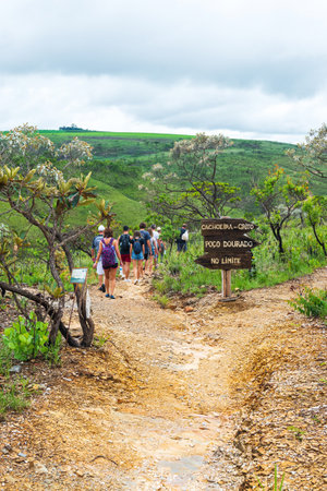 CapitÃ³lio - MG, Brazil - December 08, 2020: Group of tourists walking on the trail, eco tourism at the Trail of the Sun. Trilha do Sol in portuguese. Landscape of the Brazilian Cerrado.のeditorial素材
