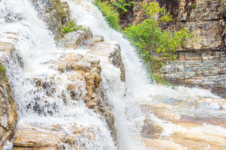Close up view of the water falling on small cascades by the sedimentary rocks. Natural beauties of CapitÃ³lio MG, Brazil.の写真素材