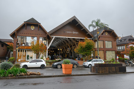 Gramado, RS, Brazil - May 19, 2022: view of Largo da Borges on a raining day, a gallery with shops and restaurants on Borges de Medeiros avenue. Tourist destination of Gramado.のeditorial素材