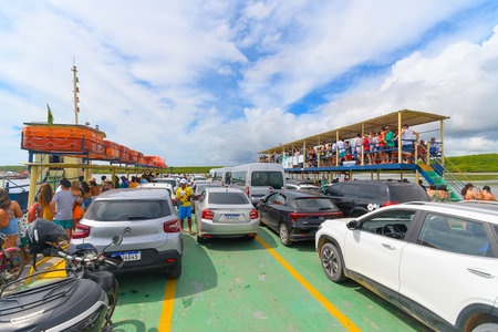 Porto Seguro, BA, Brazil - January 07, 2023: cars on the ferry crossing between Porto Seguro and Arraial d'Ajuda, Bahia state - Brazil.のeditorial素材