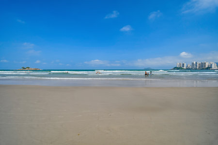 Beautiful blue sky morning at Pitangueiras beach. Beach on downtown of Guaruja, SP, Brazil.の写真素材