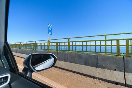 Driving the car on the Helio Serejo bridge, over the Parana river, on the BR-267 highway. Bridge that divides the states of Mato Grosso do Sul and Sao Paulo.の写真素材