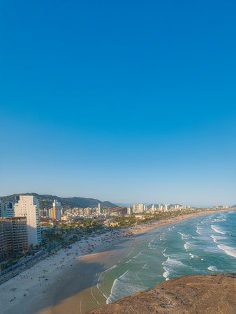 Beautiful panoramic and aerial view of Enseada Beach in Guaruja, Sao Paulo, Brazil. Captured from Mirante da Campina on a sunny day. Space for text, perfect for themes of summer, travel, vacations.の写真素材