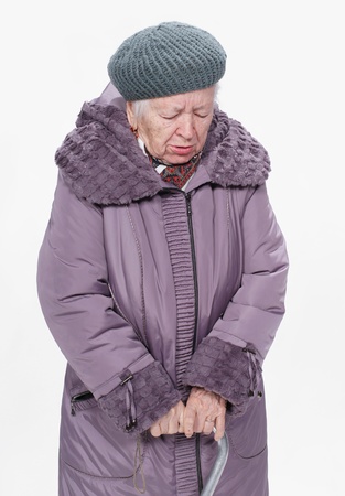 Elderly woman coughing on a white backgroundの写真素材