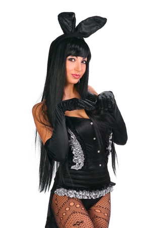 Sexy playgirl in bunny costume over white backgroundの写真素材