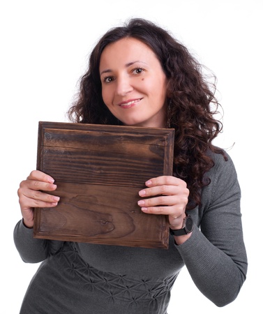 Attractive woman with wooden panel on a white backgroundの写真素材