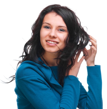 Beautiful girl with flowing hair on a white backgroundの写真素材