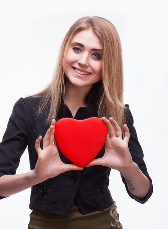 Young blond with a heart on a white backgroundの写真素材
