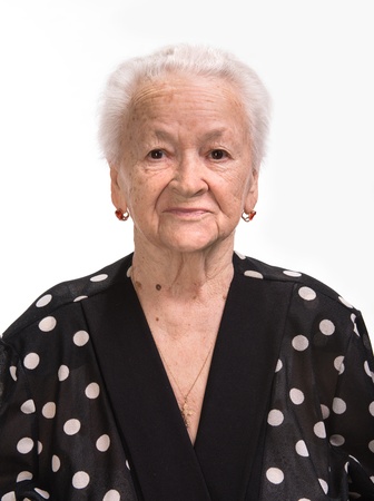 Portrait of old woman on a white backgroundの写真素材