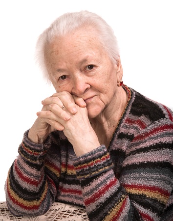 Portrait of old woman on a white backgroundの写真素材