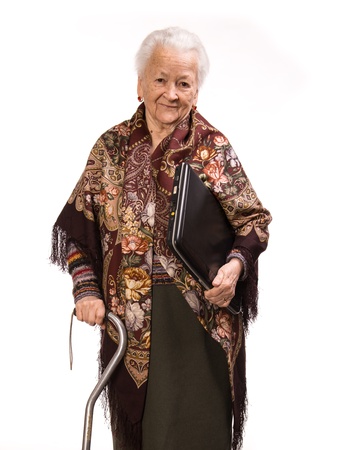Senior woman in beautiful shawl with laptop on white backgroundの写真素材