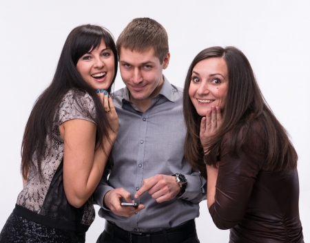 Group of surprised people looking at camera and smilingの写真素材