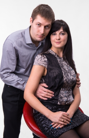 Loving couple embracing on a white backgroundの写真素材