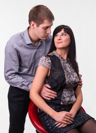 Loving couple embracing on a white backgroundの写真素材