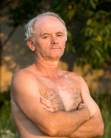 Portrait of old man on natural backgroundの写真素材