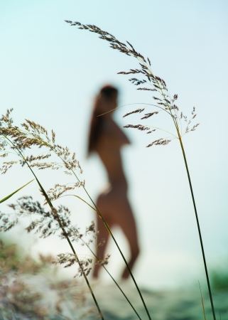 Silhouette of young nude woman の写真素材