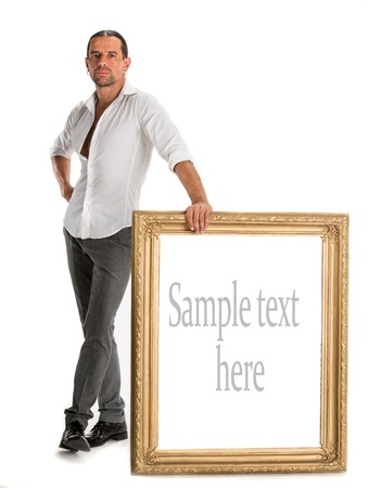 Full length of man holding a blank banner in old frame isolated on white backgroundの写真素材