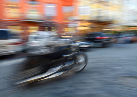 Motorcyclist in motion going down the street   Intentional motion blurの写真素材