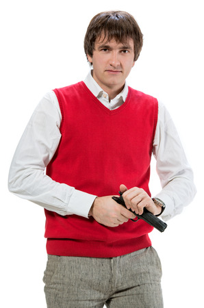 Handsome man with a gun on a white の写真素材