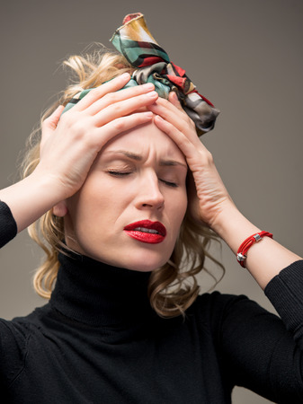 Young woman suffering from headacheの写真素材
