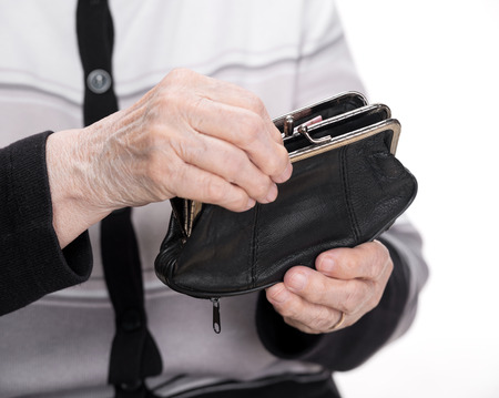Purse in the hands of an old womanの写真素材