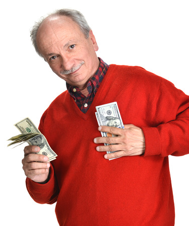 Lucky old man holding dollar bills on a white backgroundの写真素材