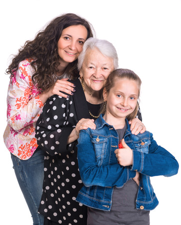 Three generations of women on a white background