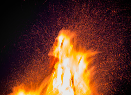 Orange fire flames on a black background