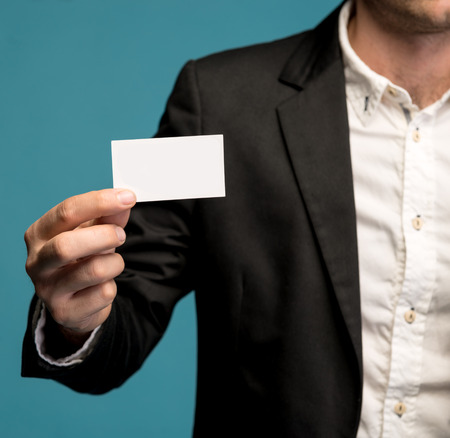 Businessman holding business card in hand